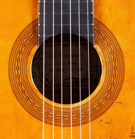 The rosette of a La Cañada "Model 17A" classical guitar made of spruce and maple