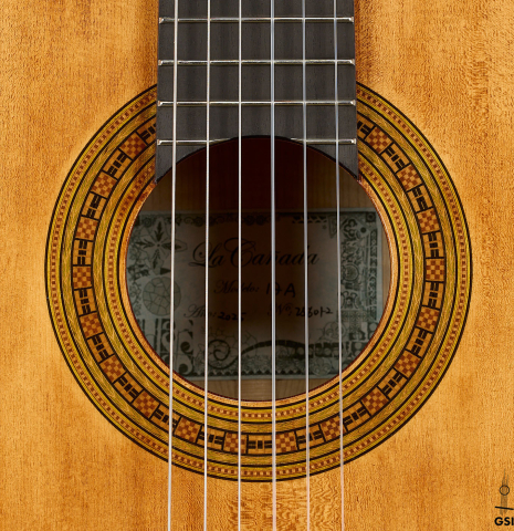 The rosette of a La Cañada "Model 17A" classical guitar made of spruce and maple