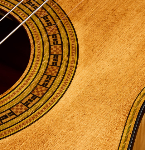 The soundboard and rosette detail of a La Cañada "Model 17A" classical guitar made of spruce and maple