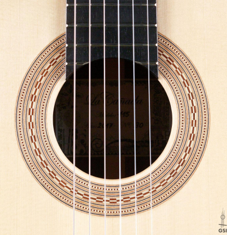 The rosette of a La Cañada "Model 115" classical guitar made with spruce and granadillo