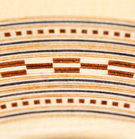 The close-up of a rosette of a La Cañada &quot;Model 115&quot; classical guitar made with spruce and granadillo