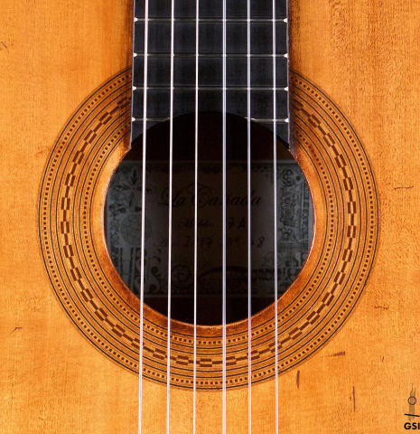 The rosette of a La Cañada "Model 17A" classical guitar made of spruce and Granadillo