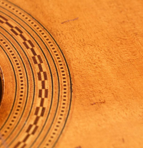 The rosette of a La Cañada "Model 17A" classical guitar made of spruce and Granadillo