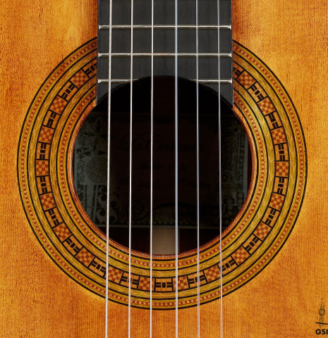 The rosette of a La Cañada "Model 17A" classical guitar made of spruce and granadillo