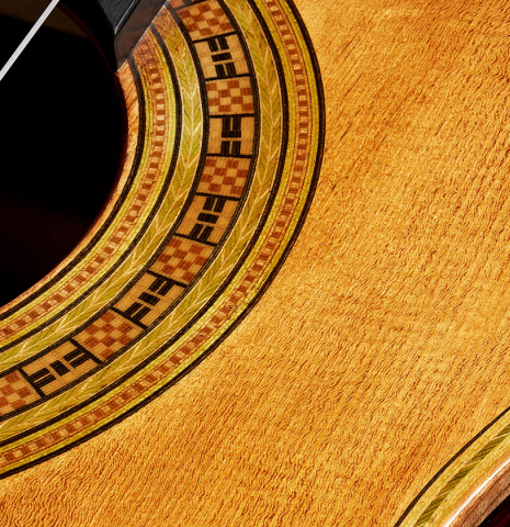 The top and rosette detail of a La Cañada "Model 17A" classical guitar made of spruce and granadillo