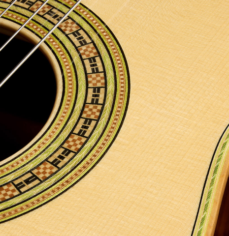 The soundboard and rosette detail of a La Cañada "Model 17" classical guitar made of spruce and Granadillo