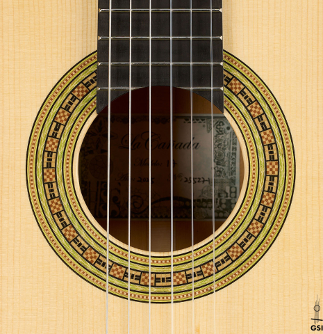 The rosette of a La Cañada "Model 17" classical guitar made of spruce and cypress