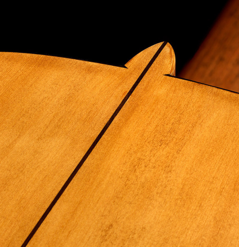 The heel, back binding and center seam of a La Cañada "Model 17A" classical guitar made of spruce and cypress