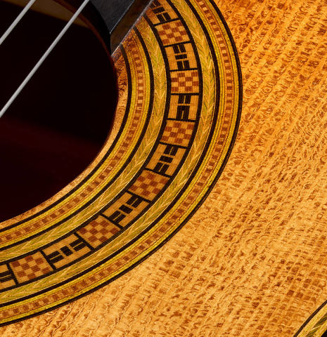 Detailed closeup of the rosette of a La Cañada "Model 17A" classical guitar made of spruce and cypress