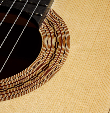 The soundboard and rosette of a La Cañada "Model 115" classical guitar made of spruce and cypress