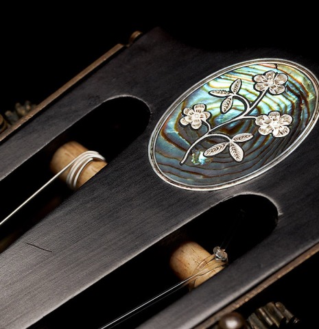 The headstock inlay with  of a c. 1845-1875 French Romantic guitar “1844 Lacôte” classical guitar made of spruce and pear wood