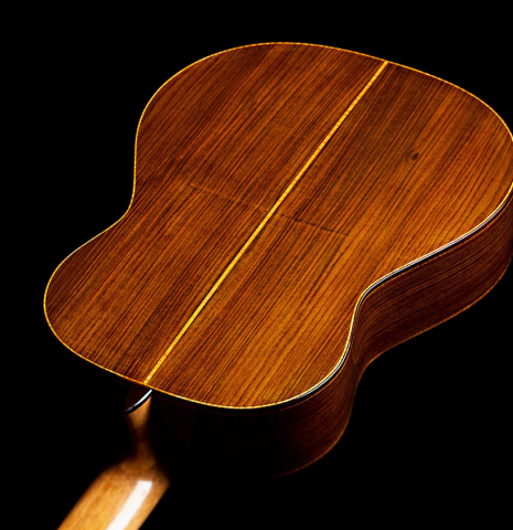 The back and sides of a 2022 Paula Lazzarini classical guitar made of cedar and Indian rosewood