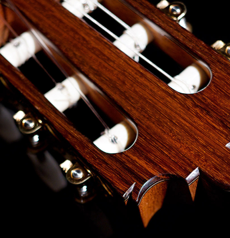 The headstock of a 2022 Paula Lazzarini classical guitar made of cedar and Indian rosewood