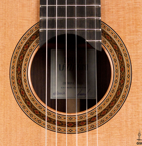The rosette of a 2022 Paula Lazzarini classical guitar made of cedar and Indian rosewood