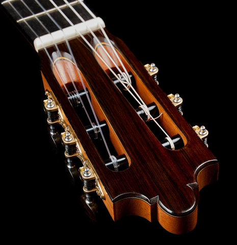 The headstock and tuning machines of a 2025 Paula Lazzarini classical guitar made of cedar and Indian rosewood