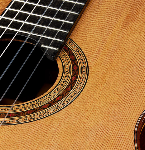 The top and rosette of a 2025 Paula Lazzarini classical guitar made of cedar and Indian rosewood