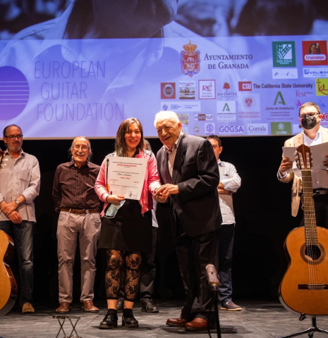 Paula Lazzarini being awarded at the 2021 Antonio Marin Guitar Making Competition in Granada, Spain