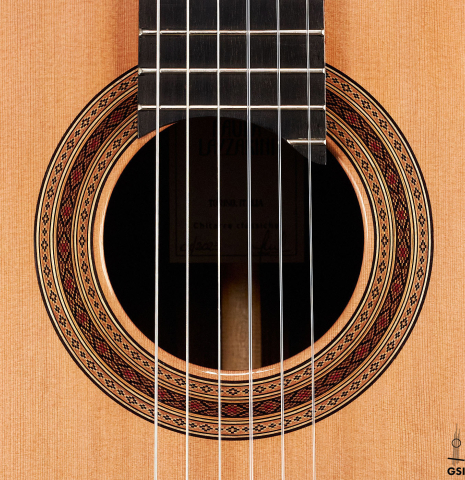 The rosette of a 2023 Paula Lazzarini classical guitar made of cedar and ziricote