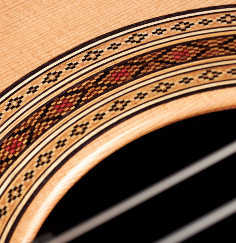 Close-up of the rosette of a 2023 Paula Lazzarini classical guitar made of cedar and ziricote
