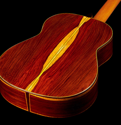 The back and sides of a 2023 Paula Lazzarini classical guitar made of cedar and cocobolo
