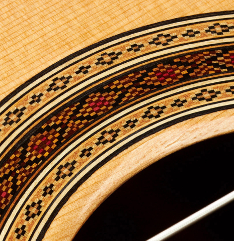 Detail of the rosette of a 2023 Paula Lazzarini classical guitar made of cedar and cocobolo