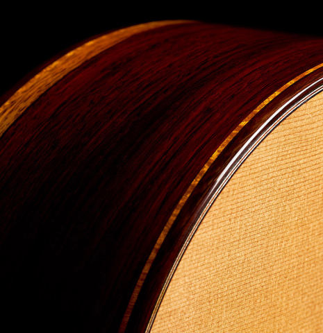 The top, side, binding and purflings of a 2023 Paula Lazzarini classical guitar made of cedar and cocobolo