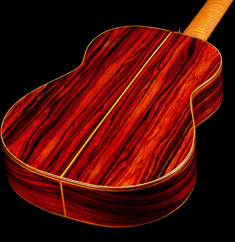 The back and sides of a 2024 Paula Lazzarini "Roma Guitar Expo" classical guitar made of cedar and cocobolo
