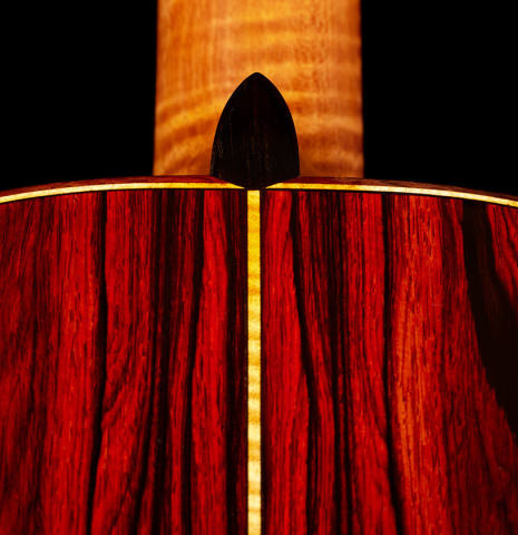 The heel, back binding and purflings of a 2024 Paula Lazzarini "Roma Guitar Expo" classical guitar made of cedar and cocobolo