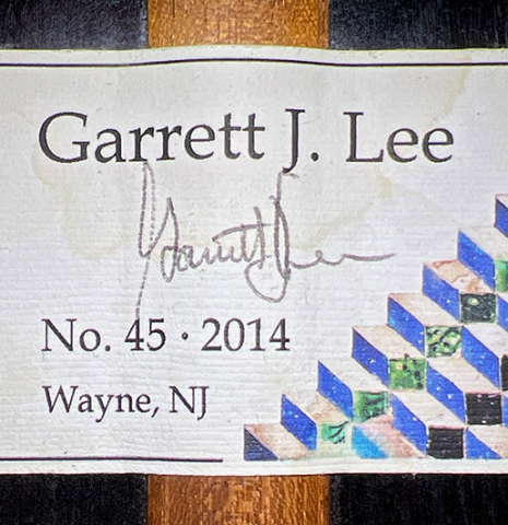 The label of a 2014 Garrett Lee classical guitar made of spruce and CSA rosewood