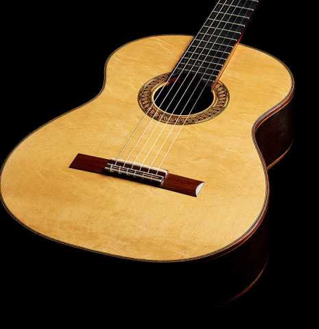 The soundboard of a 2014 Garrett Lee classical guitar made of spruce and CSA rosewood