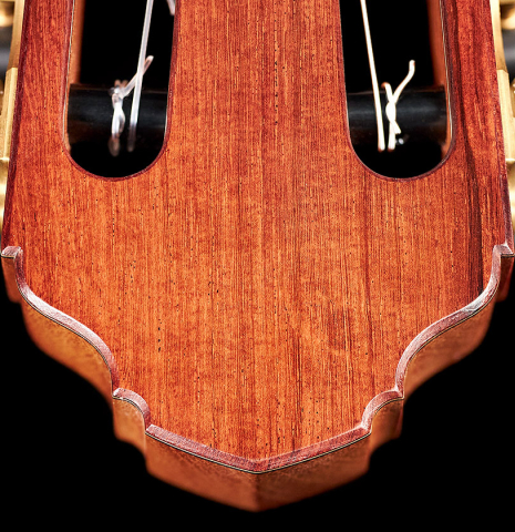 The headstock of a 2022 Francois Leonard classical guitar made of cedar and African rosewood