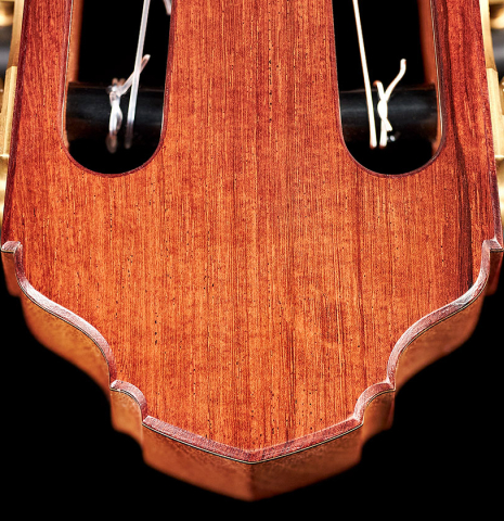 The headstock of a 2022 Francois Leonard classical guitar made of cedar and African rosewood