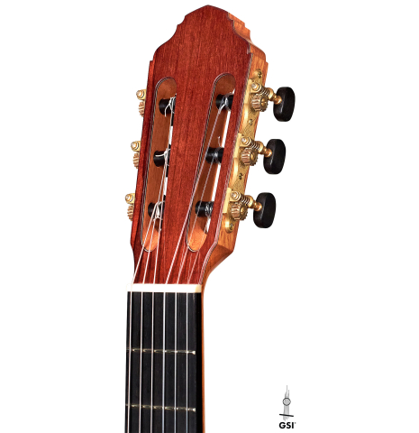The headstock of a 2022 Francois Leonard classical guitar made of cedar and African rosewood