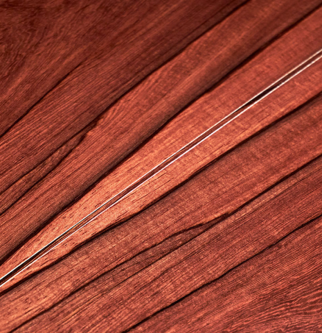 A close-up of the back of a 2022 Francois Leonard classical guitar made of spruce and African rosewood