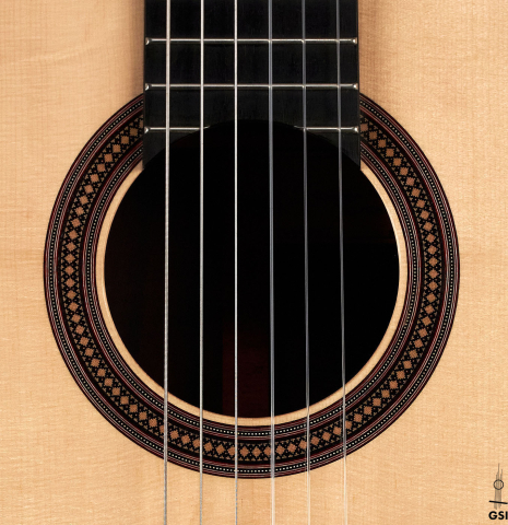The rosette of a 2022 Francois Leonard classical guitar made of spruce and African rosewood