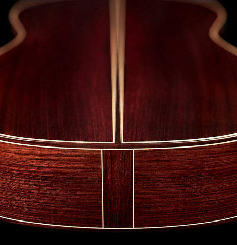 The back and sides at the foot of a 2023 Valerio Licari classical guitar made with spruce and Indian rosewood