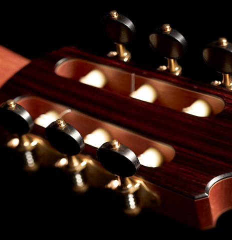 The back head veneer and tuning machines of a 2023 Valerio Licari classical guitar made with spruce and Indian rosewood