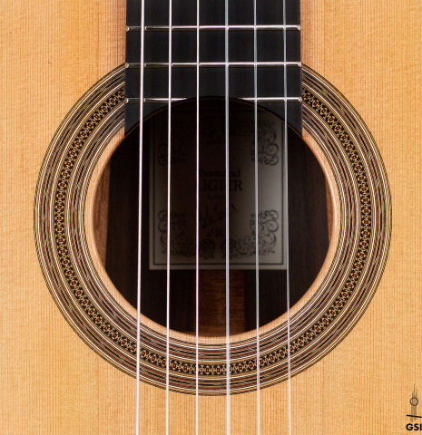 The rosette of a 2021 Bertrand Ligier classical guitar made of cedar and Indian rosewood