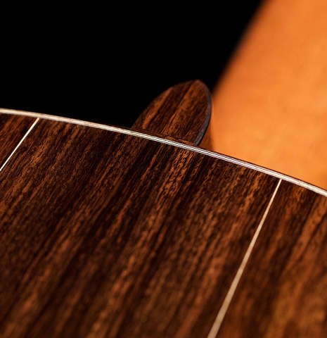 The back and heel of a 2021 Bertrand Ligier classical guitar made of cedar and Indian rosewood