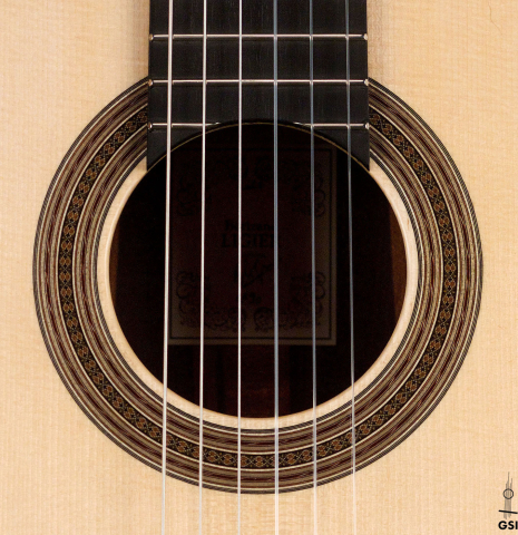 The rosette of a 2021 Bertrand Ligier classical guitar made of spruce and African rosewood
