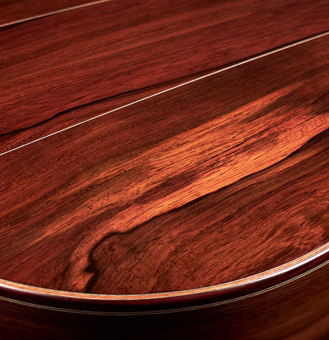 The back and sides of a 2023 Bertrand Ligier classical guitar made of spruce and African rosewood