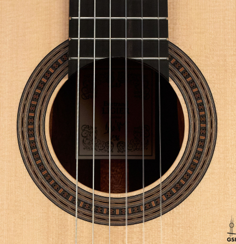 The rosette of a 2023 Bertrand Ligier classical guitar made of spruce and African rosewood