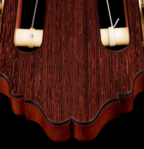 The headstock and tuning machine rollers of a 2023 Bertrand Ligier classical guitar made of spruce and African rosewood