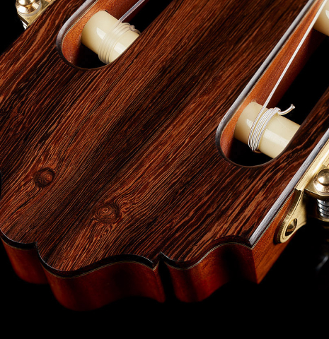 The headstock and tuning machines of a 2024 Bertrand Ligier classical guitar made of spruce and African rosewood
