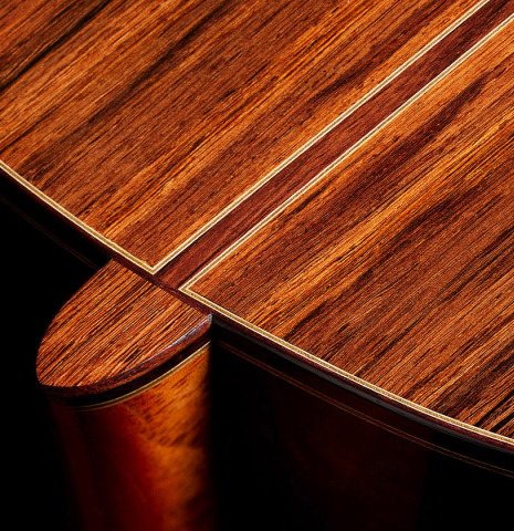 The back, binding and heel of a 2024 Bertrand Ligier classical guitar made of spruce and African rosewood