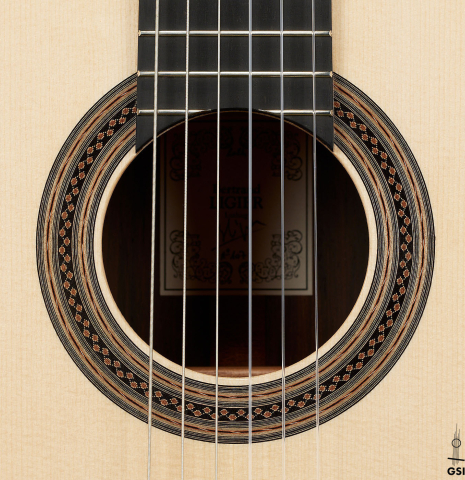 The rosette of a 2024 Bertrand Ligier classical guitar made of spruce and African rosewood