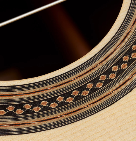 Close-up detail of the rosette of a 2024 Bertrand Ligier classical guitar made of spruce and African rosewood