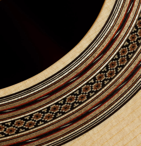Closeup detail of the rosette of a 2025 Bertrand Ligier classical guitar made of spruce and African rosewood