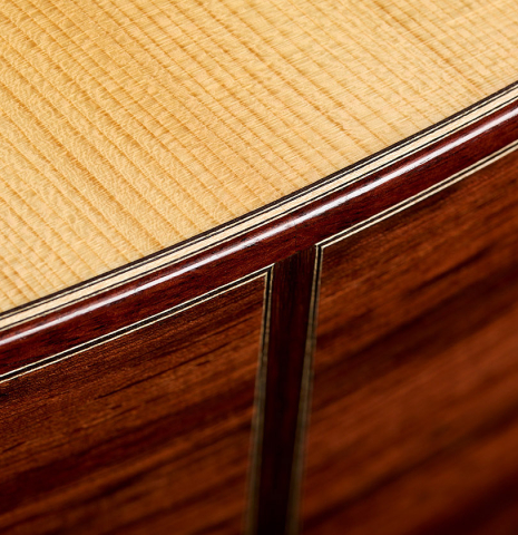 The soundboard binding and purfling of a 2026 Bertrand Ligier classical guitar made of spruce and African rosewood