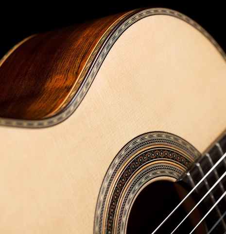 The soundboard and rosette of a 2021 Luigi Locatto classical guitar made of spruce and CSA rosewood